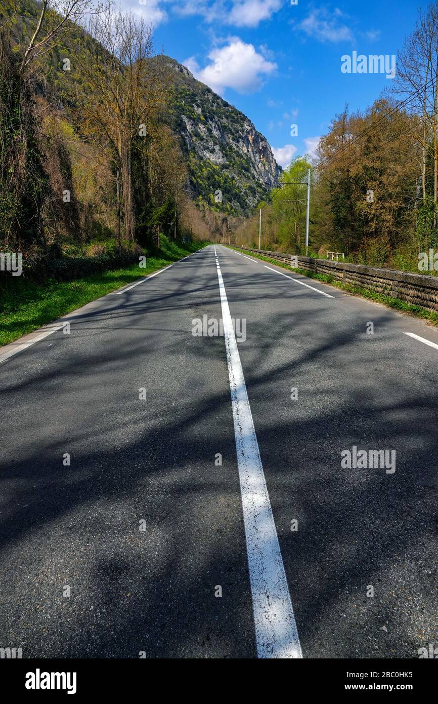 Empty road during coronavirus lockdown, Ornolac, Ussat les Bains, Ariege, French Pyrenees, France Stock Photo
