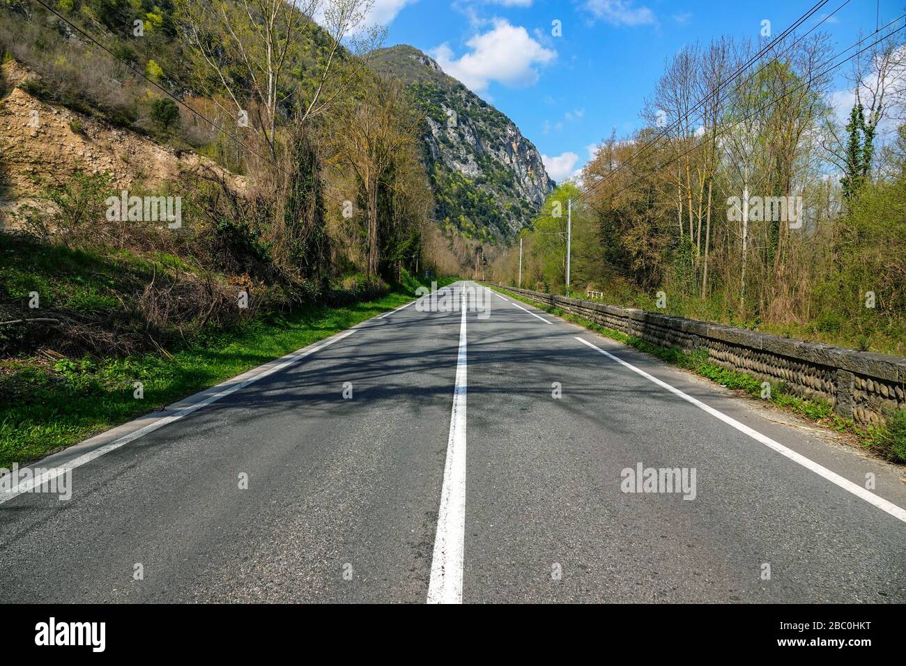 Empty road during coronavirus lockdown, Ornolac, Ussat les Bains, Ariege, French Pyrenees, France Stock Photo