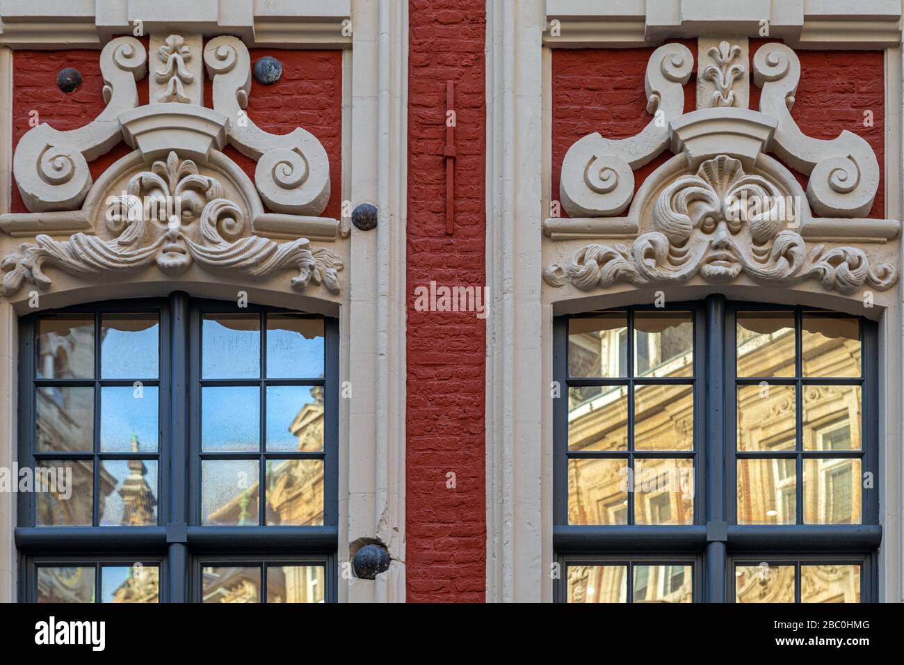 DECORATIVE MASCARON, FACADE OF A BUILDING LISTED AS A HISTORICAL MONUMENT, RUE DE LA BOURSE, OLD LILLE NEAR THE GRAND'PLACE,  LILLE, NORD, FRANCE Stock Photo