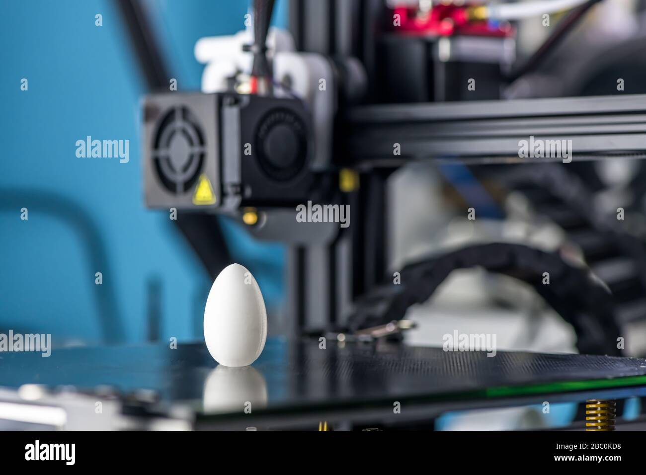white plastic model of egg printed on a 3D printer. modern technology. Stock Photo
