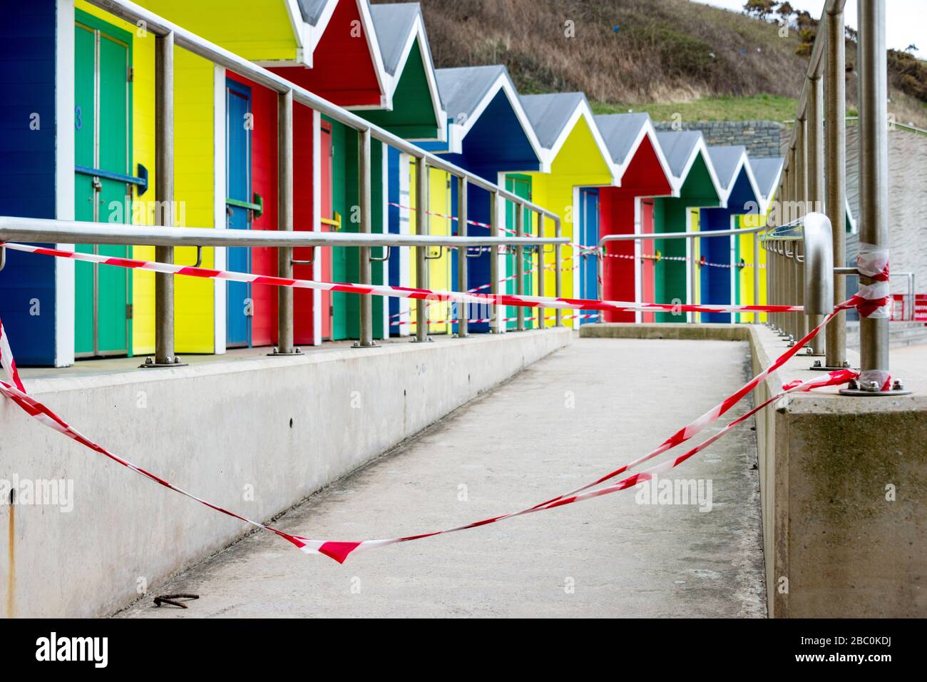 Beach huts at Barry Island are taped off to discourage access during the Covid-19 crises. Stock Photo
