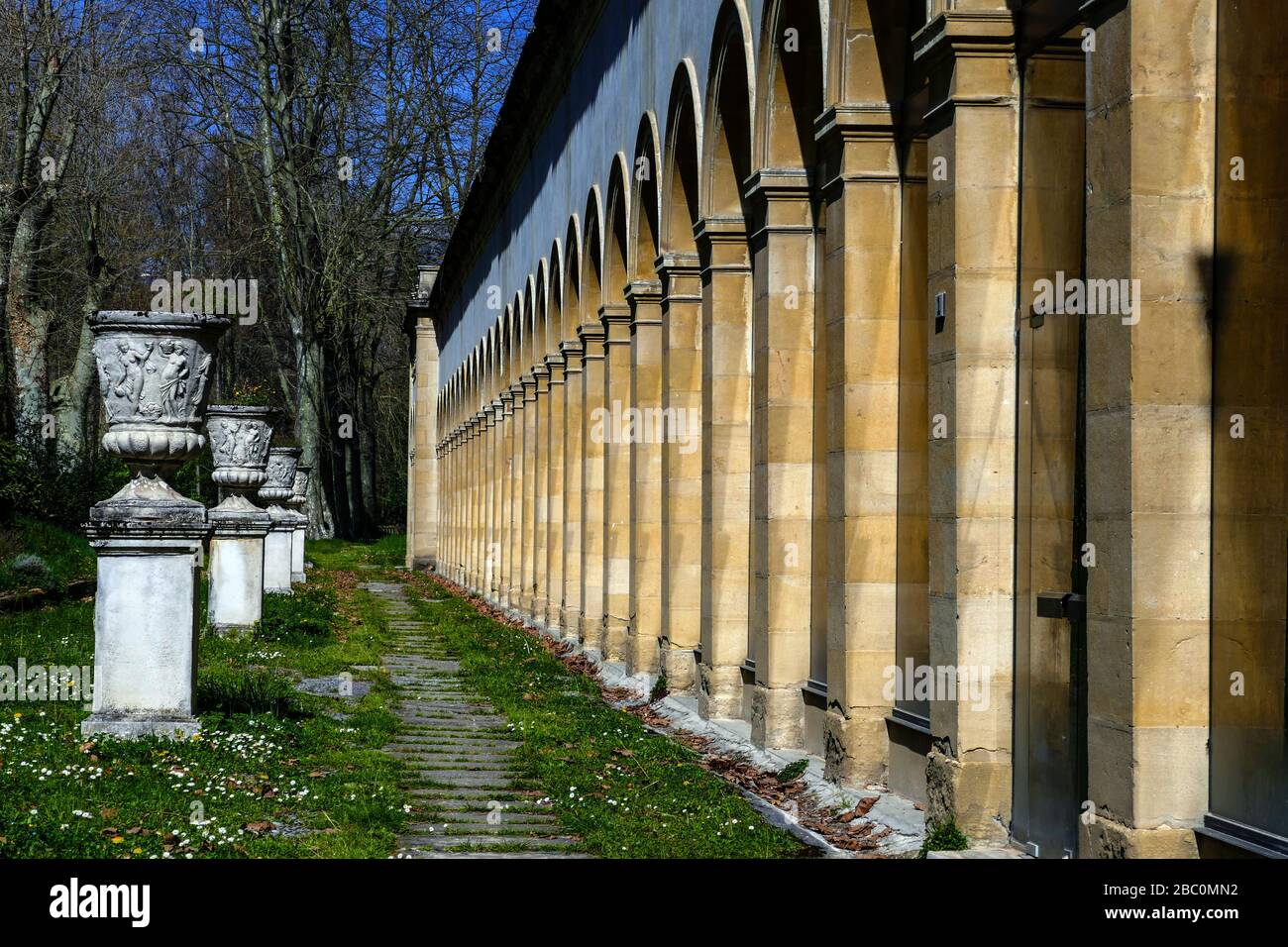 Concrete flower urn and geometric arches of thermal spa, at Ornolac, Ussat les Bains, Ariege, French Pyrenees, France Stock Photo