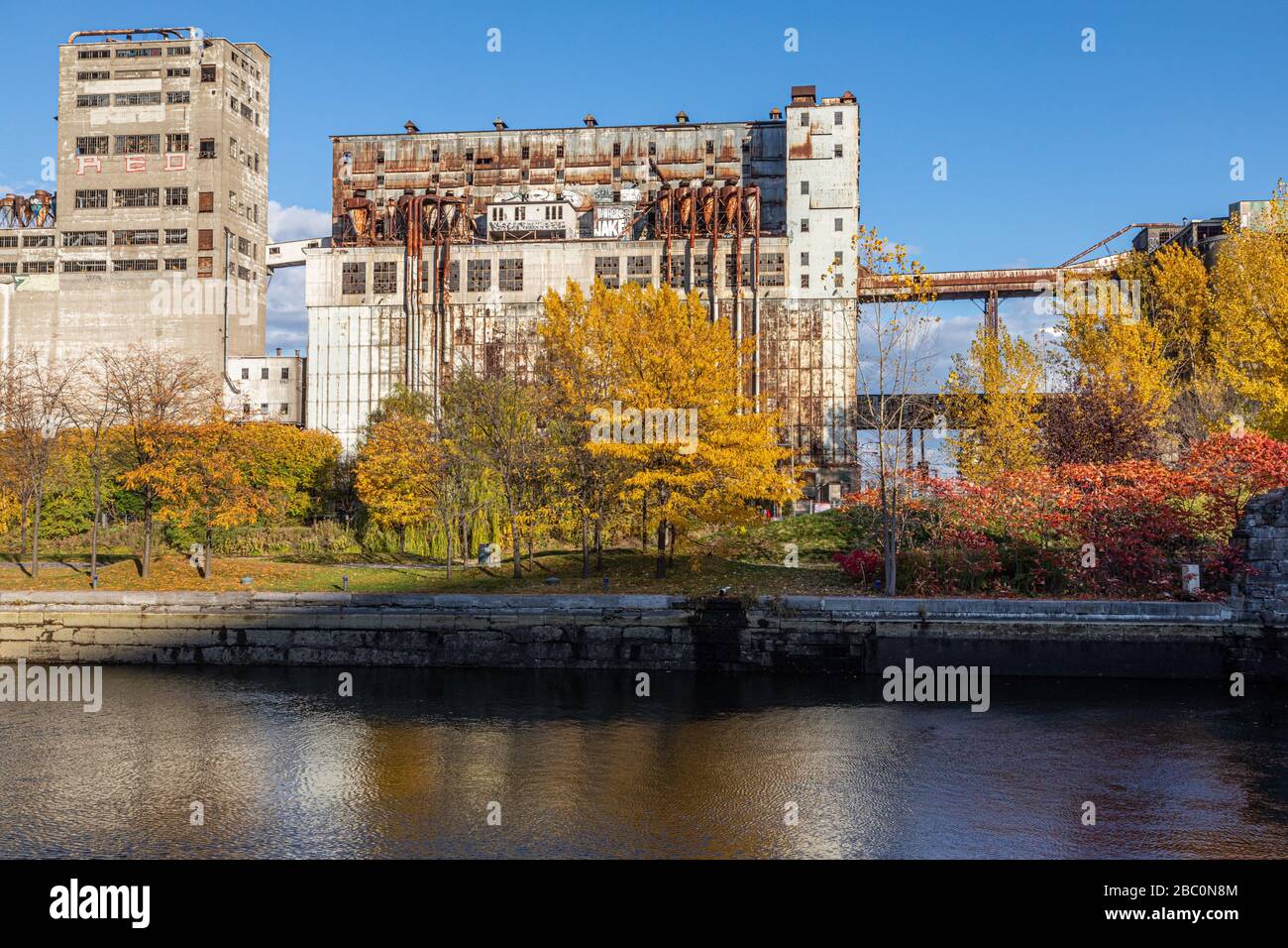 OLD FLOUR MILLS IN AUTUMN COLORS, MONTREAL, QUEBEC, CANADA Stock Photo