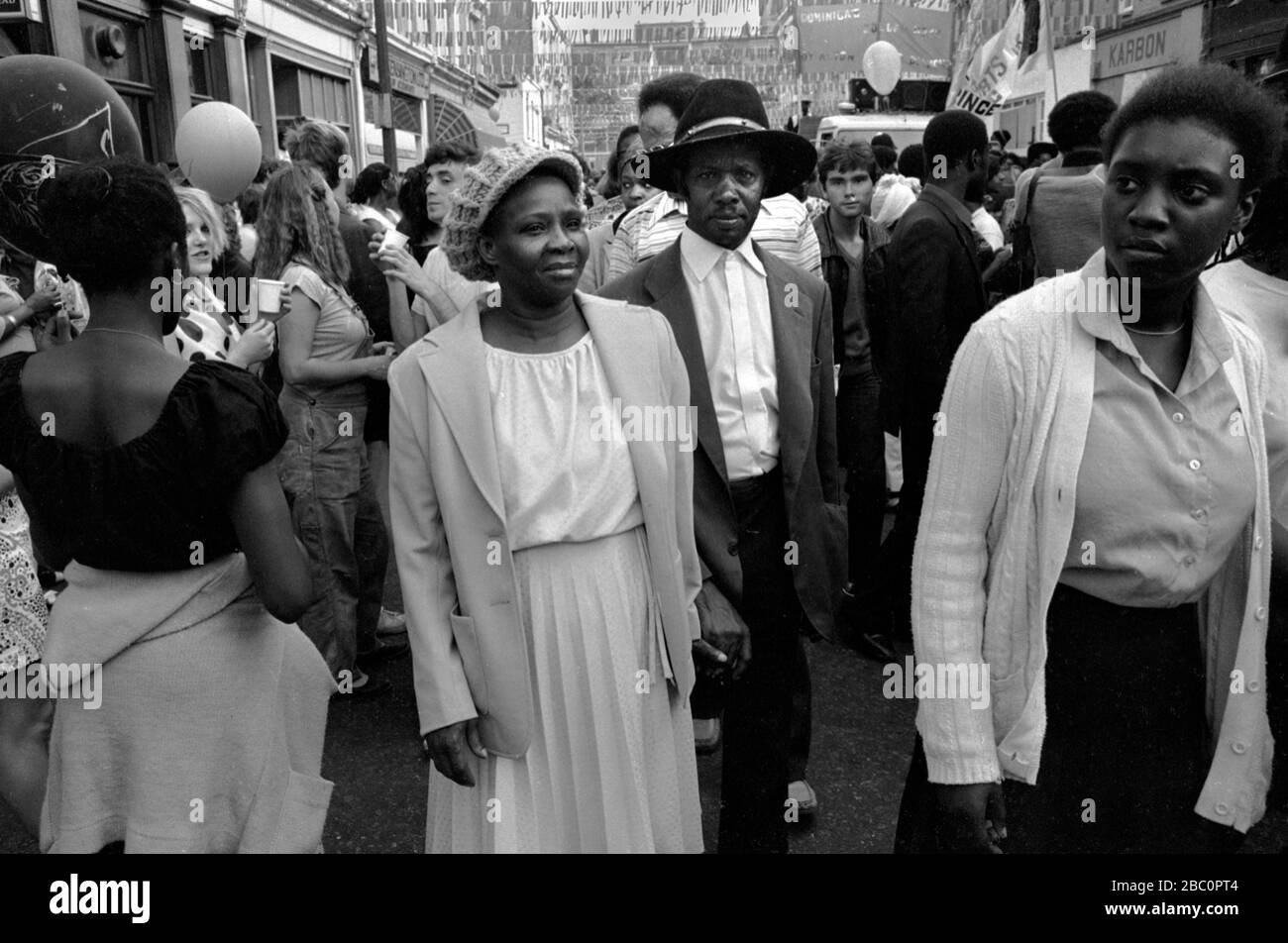 Senior black couple in crowd at the Notting hill Carnival 1981 London1980s multiracial England HOMER SYKES Stock Photo