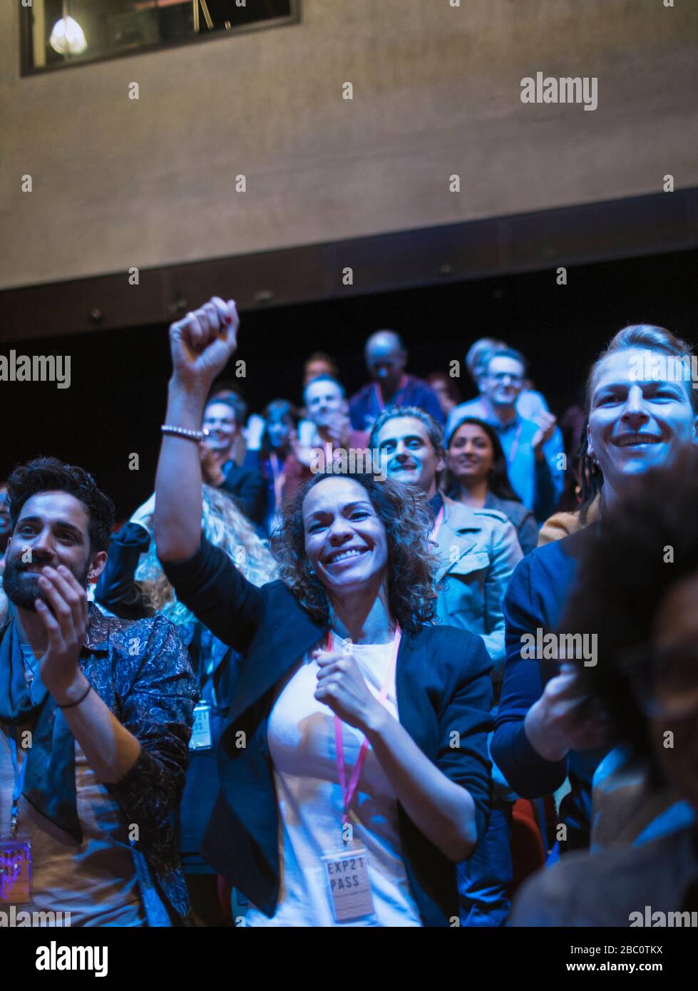 Enthusiastic audience cheering Stock Photo