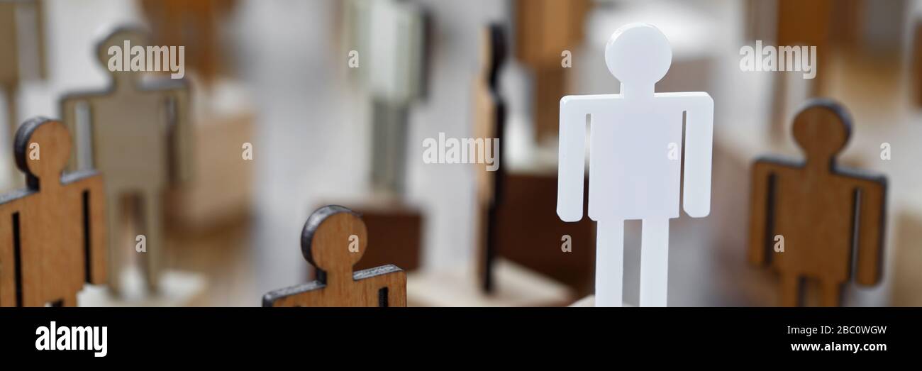 Carved multi-colored wooden figures man in suit Stock Photo