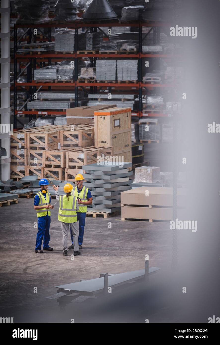 Worker talking in warehouse Stock Photo