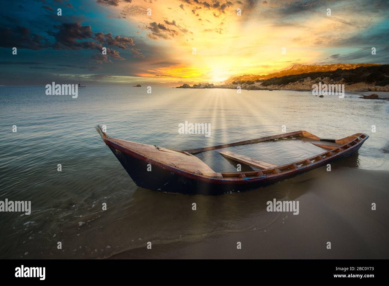 Old wooden boat wrecked on a sandy beach Stock Photo - Alamy
