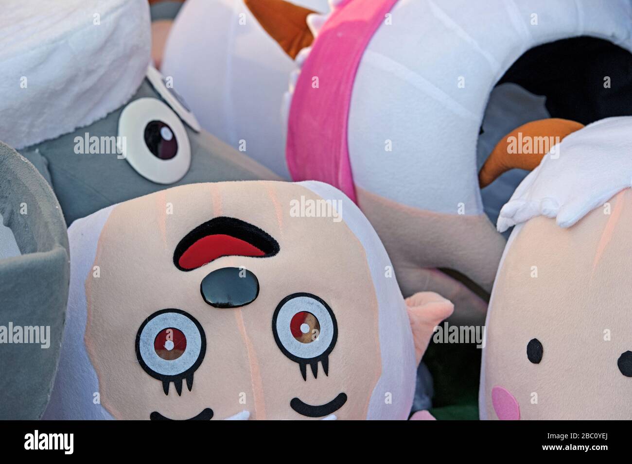 A pile of foam rubber mascot heads Stock Photo Alamy