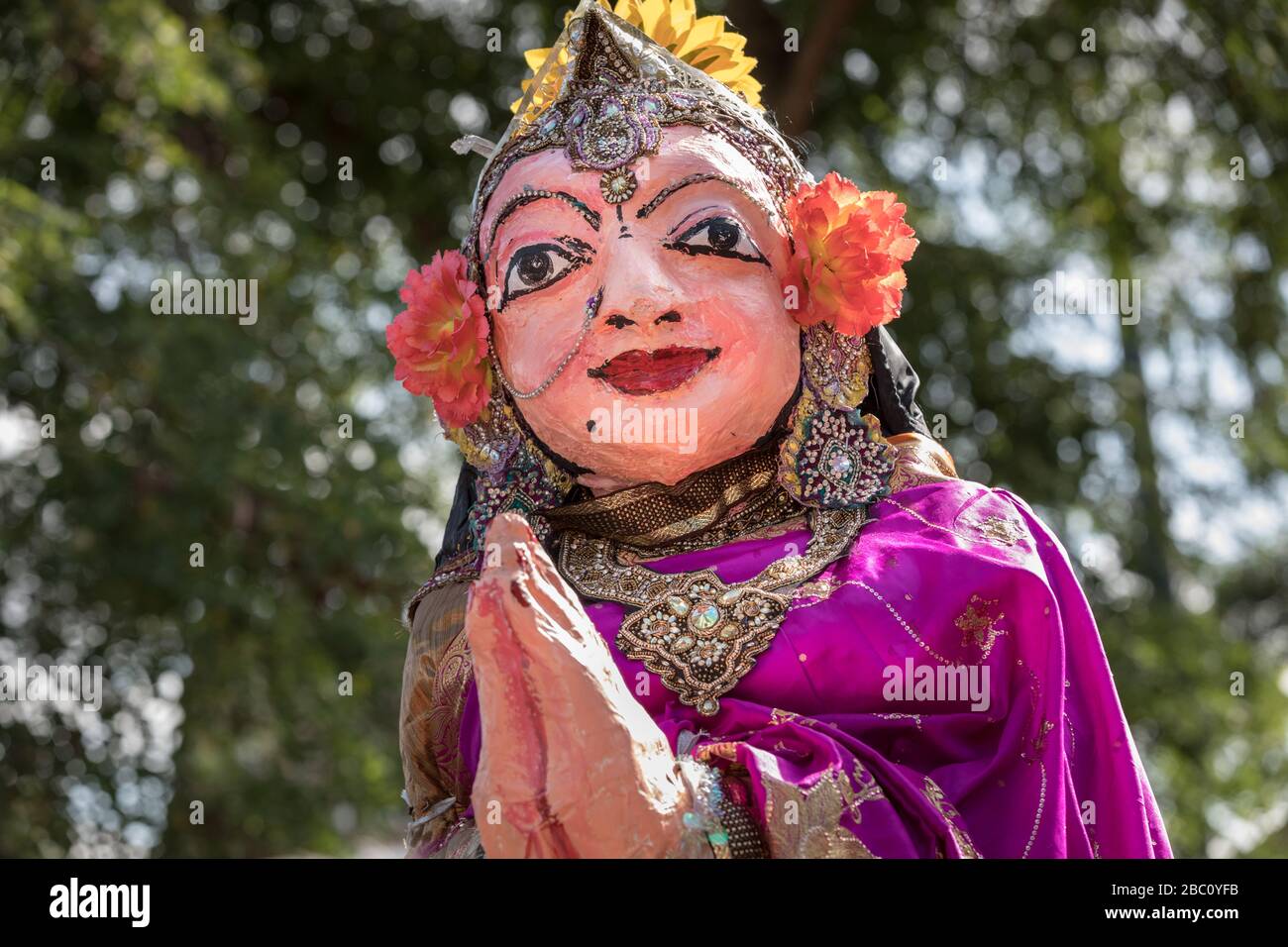 Large puppet of Hindu deity, elaborately decorated in sary, carried as part of a Chariot Procession and religious festival Stock Photo
