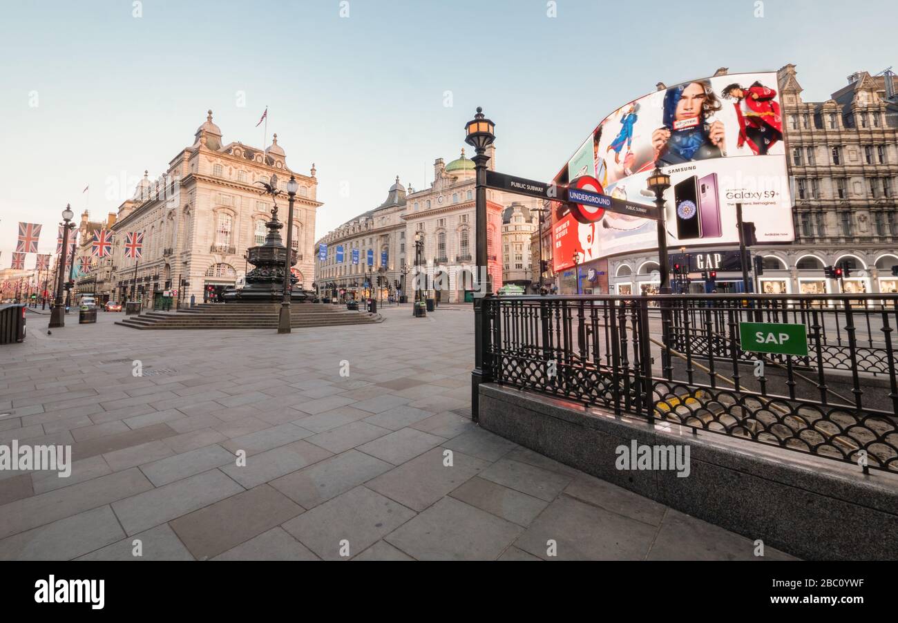 Empty London. Piccadilly Circus, normally one of the busiest areas of London, with no traffic or pedestrians in view. Stock Photo