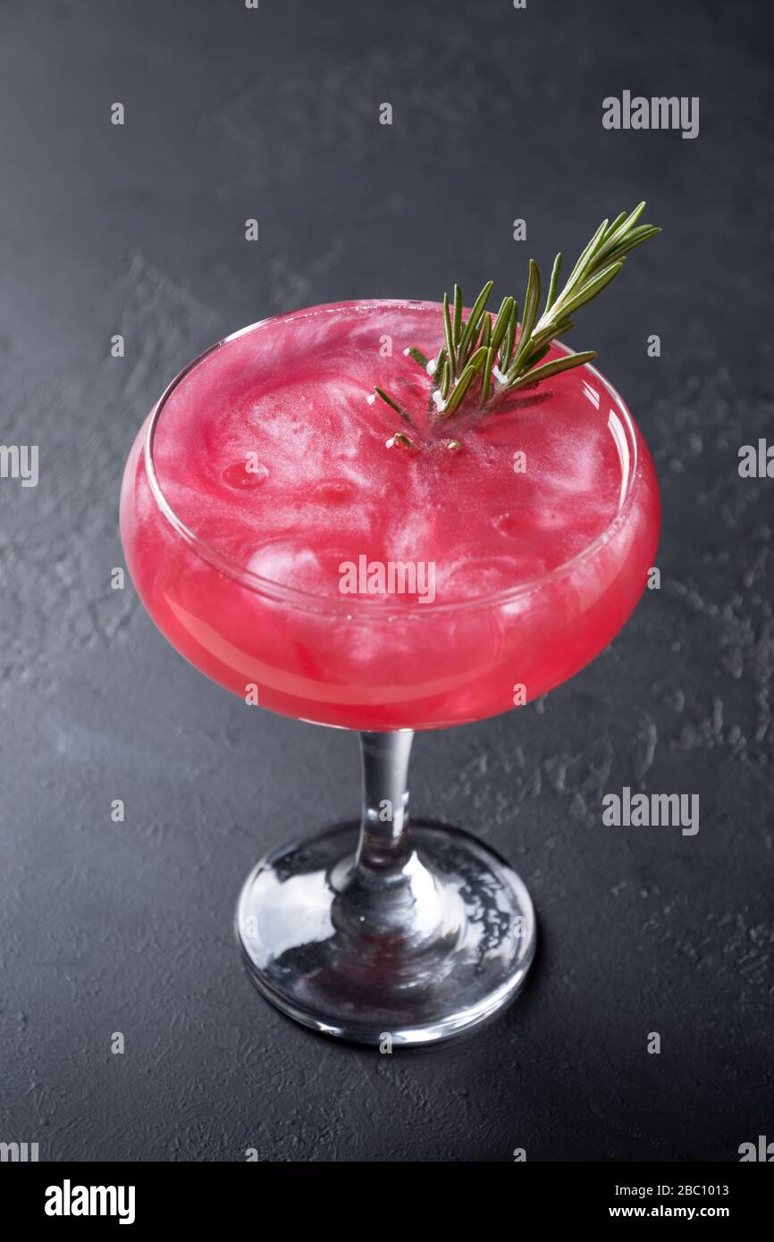 Shimmer edible glitter sparkling rose wine garnish rosemary on black