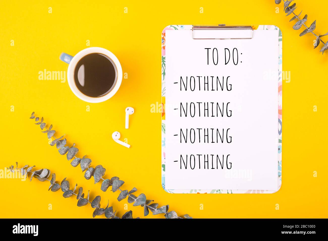 To Do Nothing Is Written On Yellow Background With Eucalyptus Branches