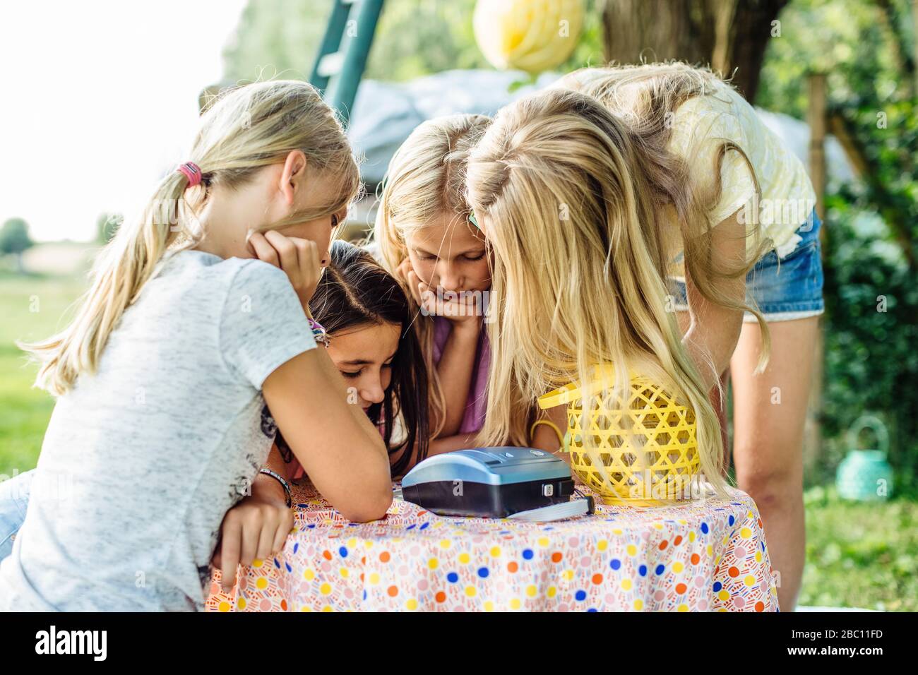 Girls on a birthday party outdoors Stock Photo