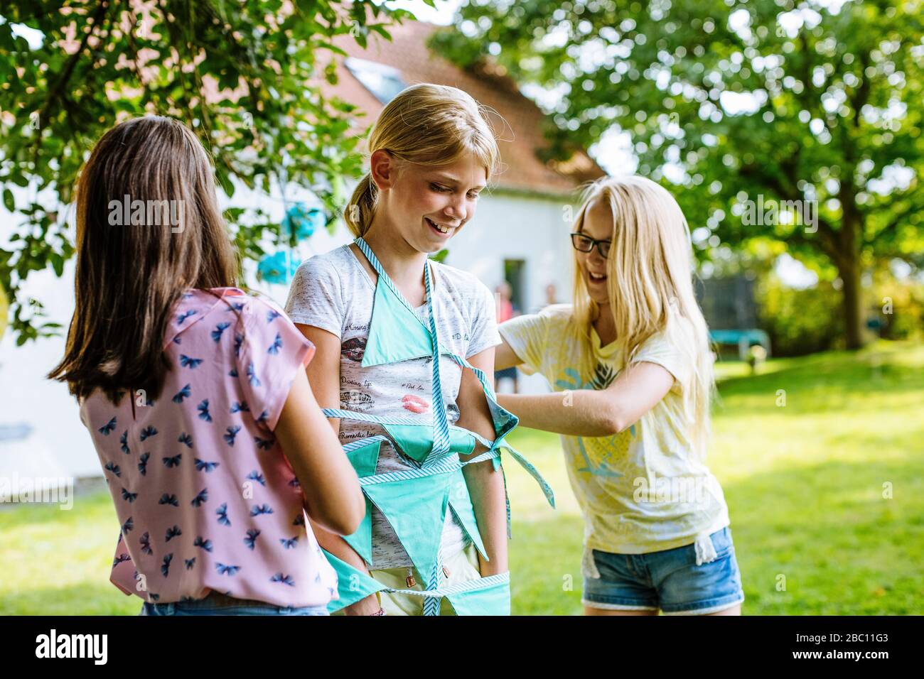 Happy girls having fun on a birthday party outdoors Stock Photo - Alamy