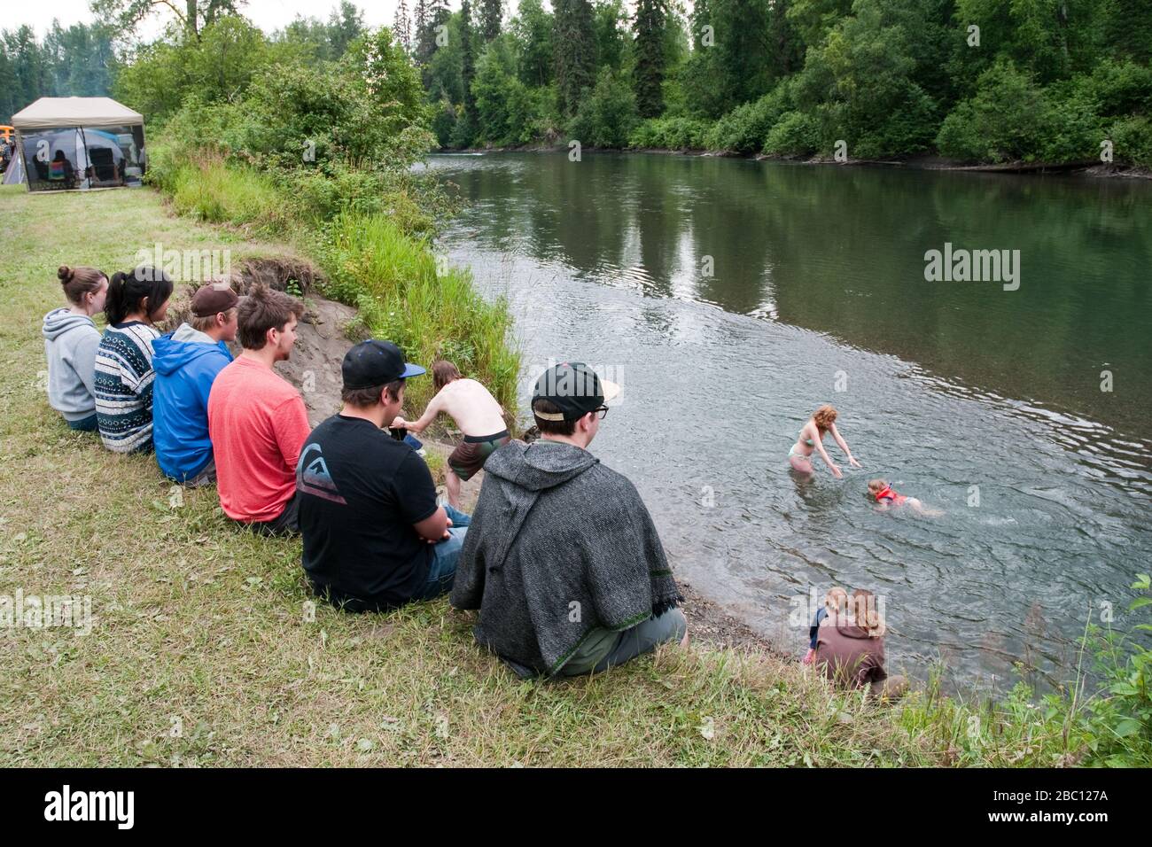 Locals swimming in the Kispiox River, a tributary of the Skeena River, in Gitsxan First Nation territory, Northern British Columbia, Canada. Stock Photo