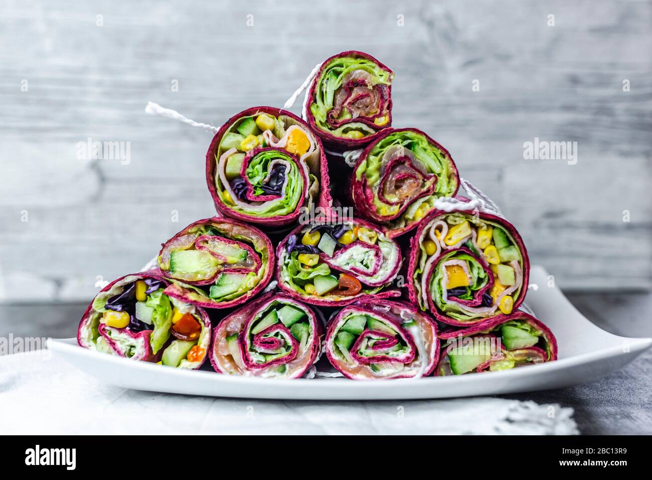 Stack of various ready-to-eat beetroot wraps Stock Photo