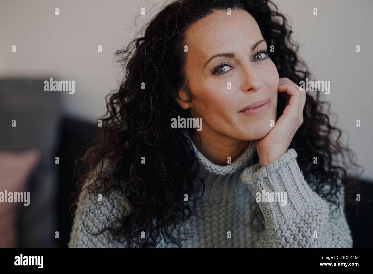 Portrait of a beatiful woman, with chin in hand Stock Photo