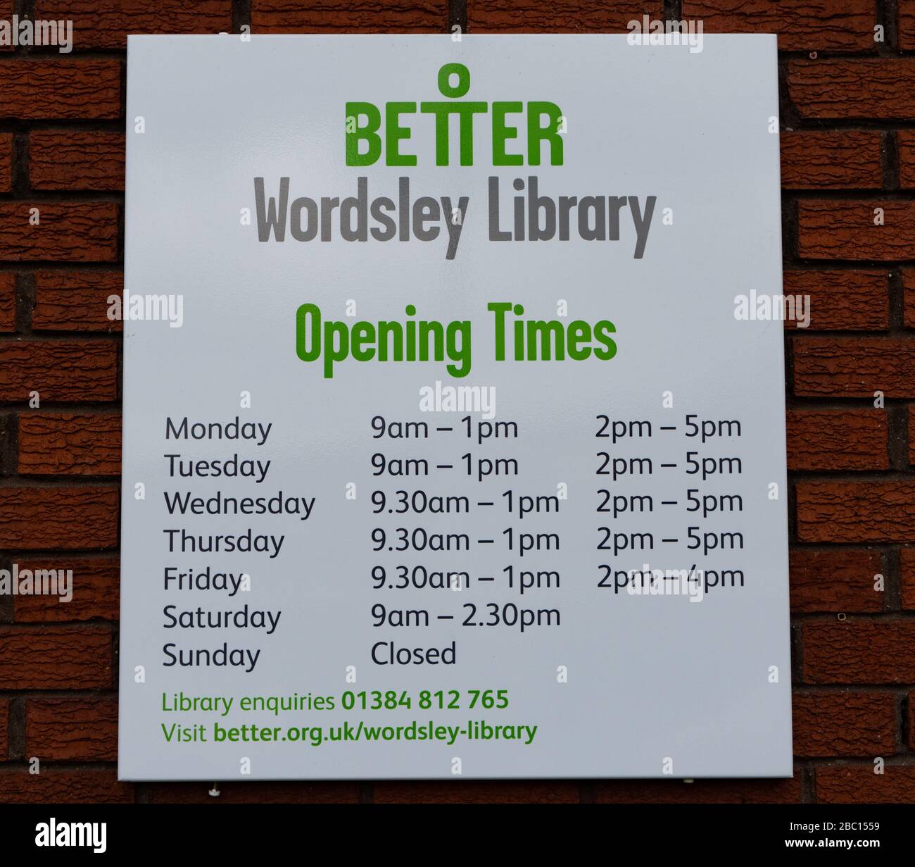 Wordsley Library opening times sign. West Midlands. UK Stock Photo Alamy