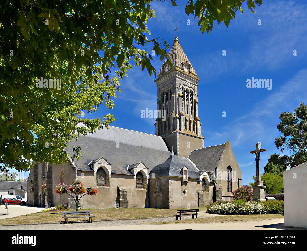 Church among tree of Noirmoutier en l’Ile in Pays de la Loire, region in western France Stock Photo