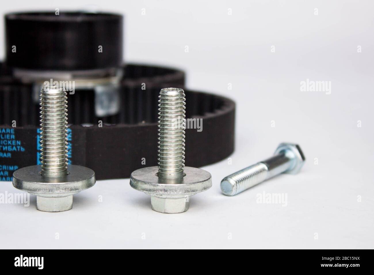 Repair kit: gear belt and bolts isolated on a white background. Stock Photo