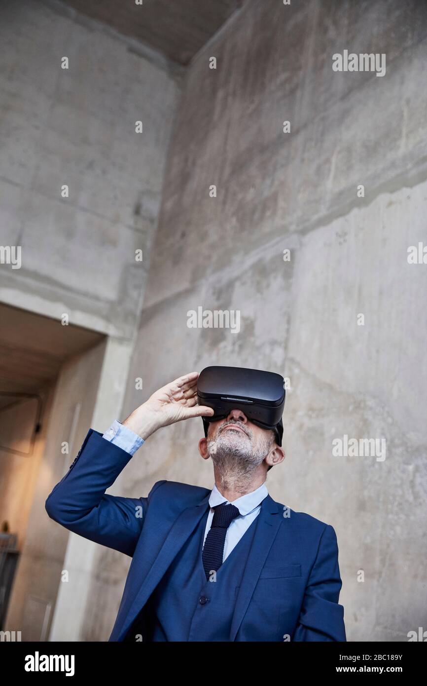 Senior businessman using VR glasses Stock Photo