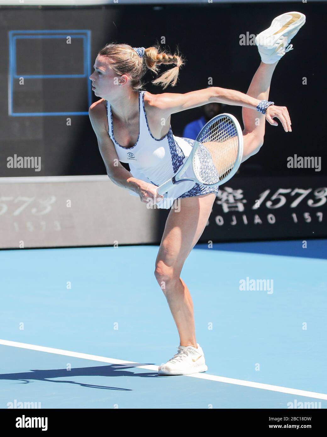 Italian tennis player Camila Giorgi serving in Australian Open 2020 tennis tournament, Melbourne Park, Melbourne, Victoria, Australia Stock Photo