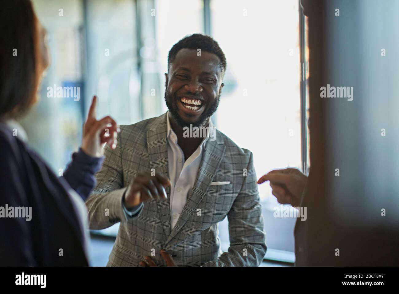 Laughing business people meeting in hotel lobby Stock Photo - Alamy