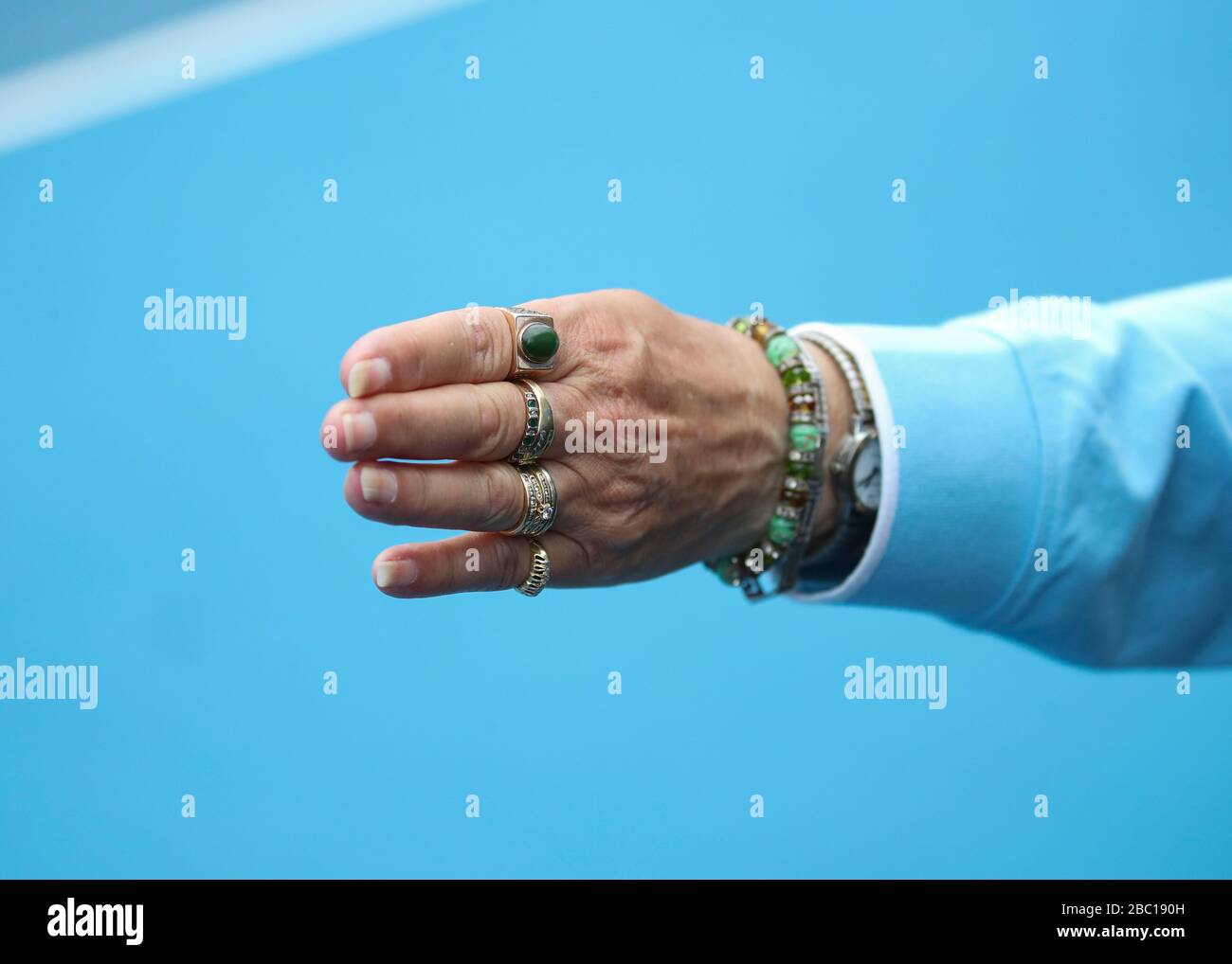 Stretched out arm of lines woman at the  Australian Open 2020 tennis tournament, Melbourne Park, Melbourne, Victoria, Australia Stock Photo