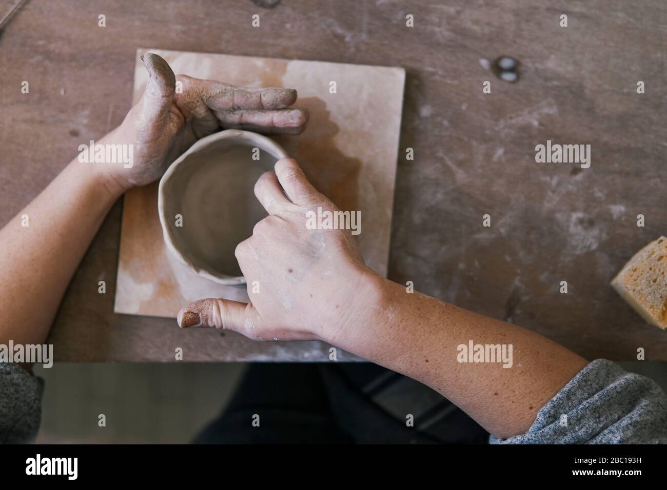Close-up of potter working on workpiece Stock Photo
