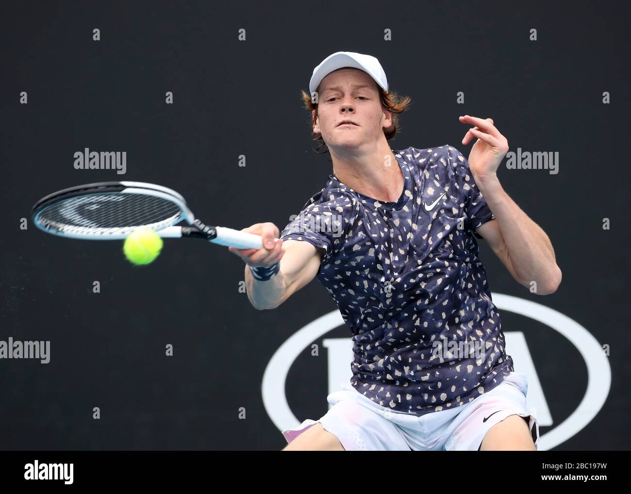 Italian tennis player Jannik Sinner playing forehand shot in Australian Open 2020 Tennis Tournament, Melbourne Park, Melbourne, Victoria, Australia. Stock Photo