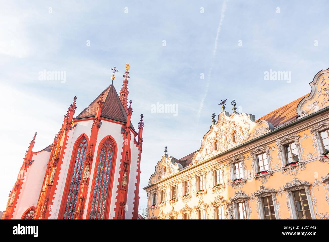 Germany, Bavaria, Wurzburg, Low angle view of Marienkapelle and Falkenhaus Stock Photo