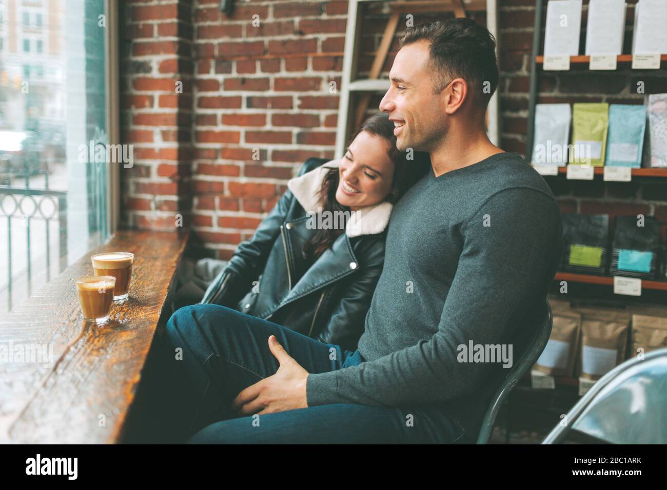 Happy couple having coffee in a cafe Stock Photo