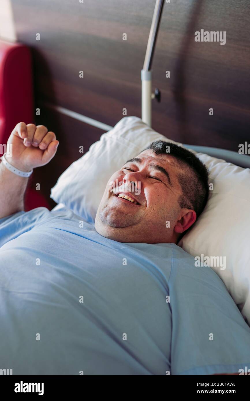 Laughing hospital bed hi-res stock photography and images - Alamy