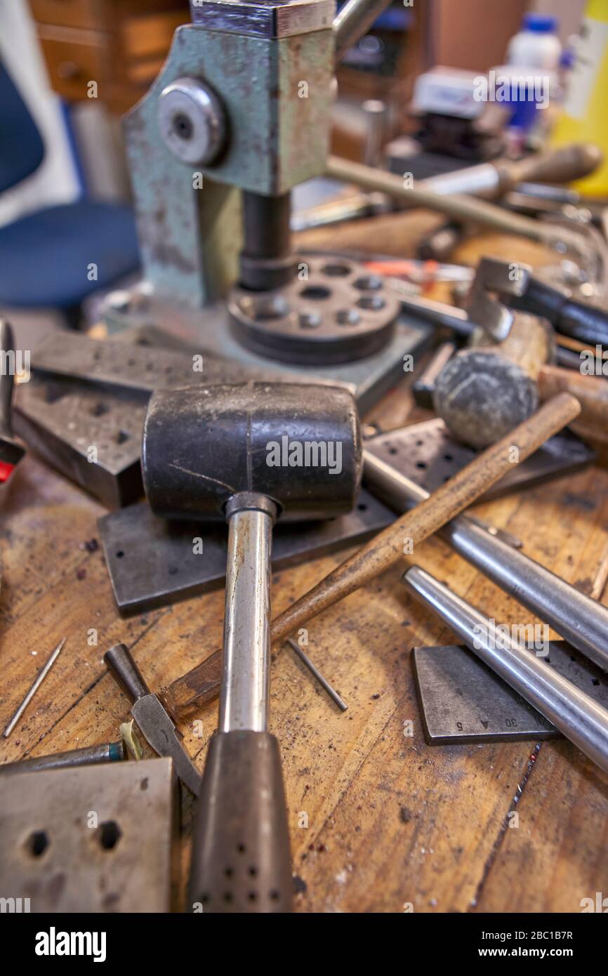 Goldsmith, different kind of tools on workbench Stock Photo