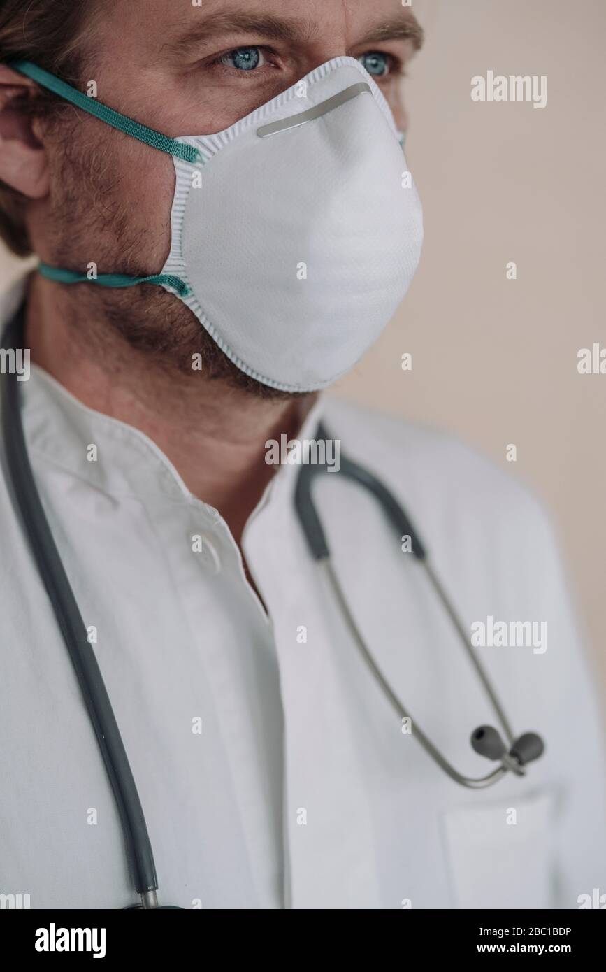 Doctor man wearing stethoscope blue hi-res stock photography and images ...