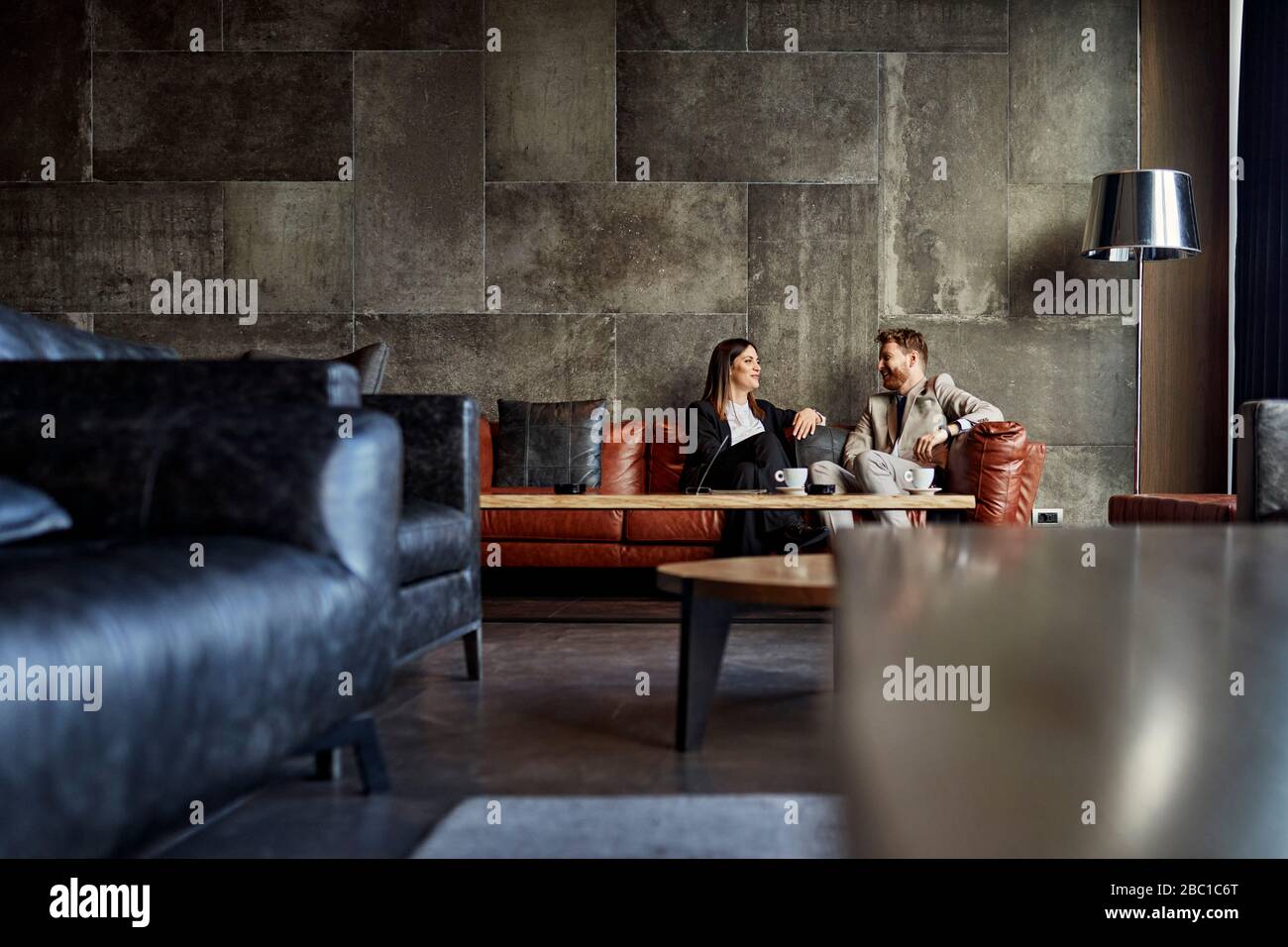 Sitting in hotel lounge hi-res stock photography and images - Alamy