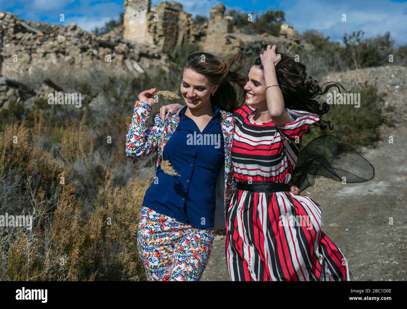Two fashionable friends in rural scene, Almeria Spain Stock Photo