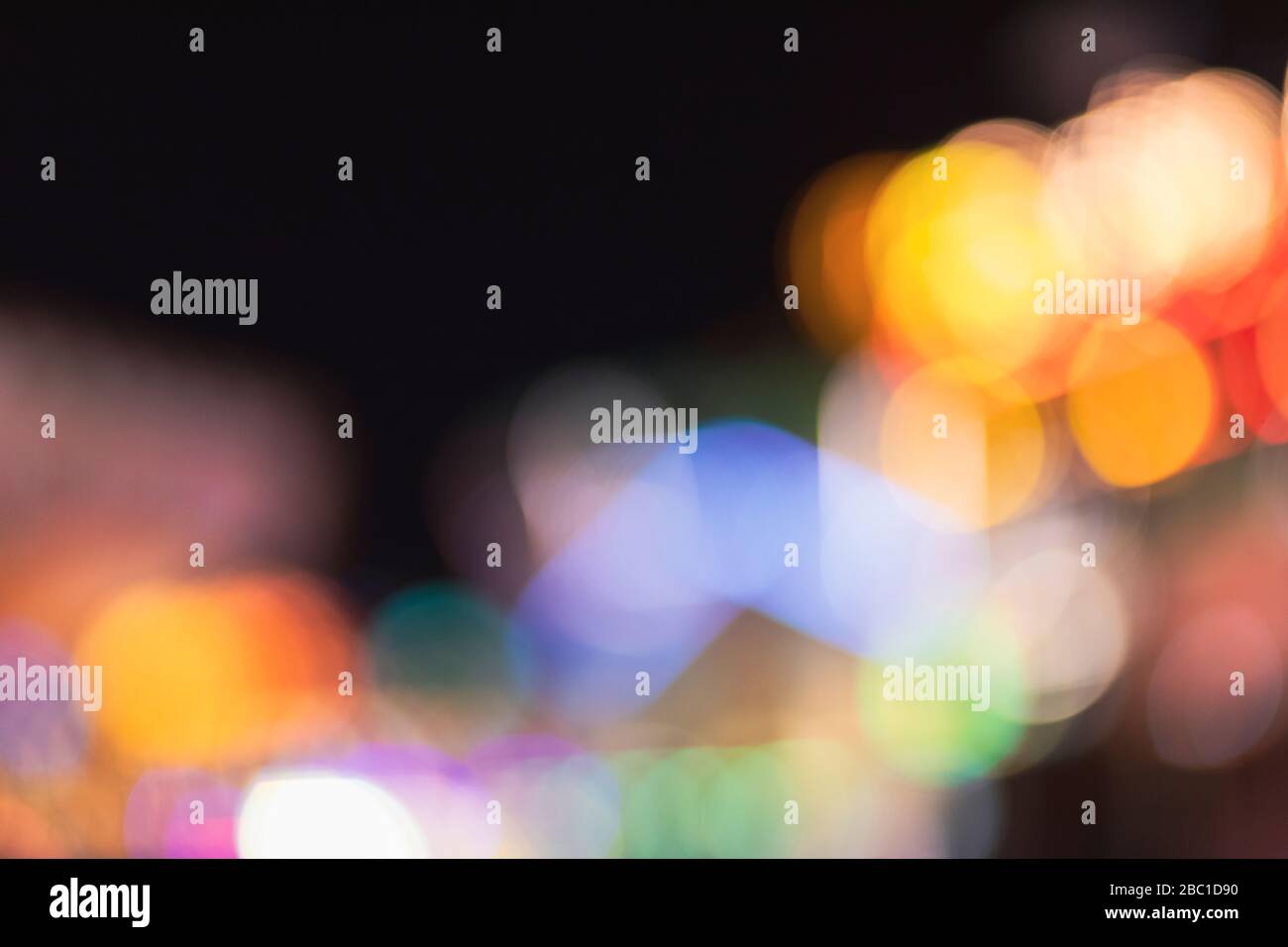 Germany, Colorful defocused lights at night Stock Photo