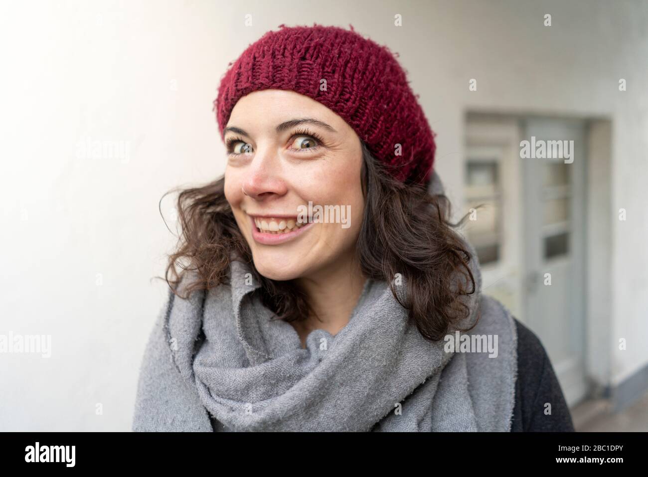 Portait of smiling woman in winter clothes Stock Photo