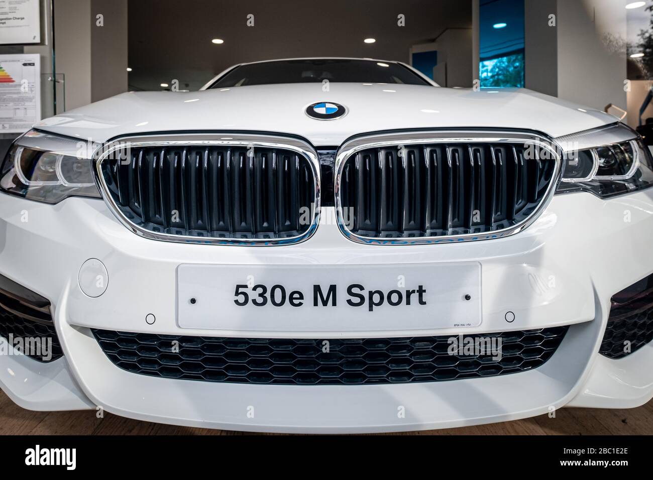 BMW 530e M Sport car in dealership showroom London Stock Photo Alamy
