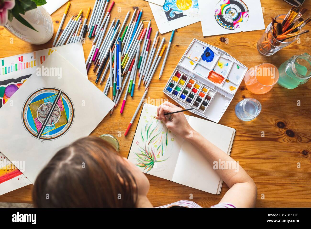 Woman painting with watercolours, top view Stock Photo