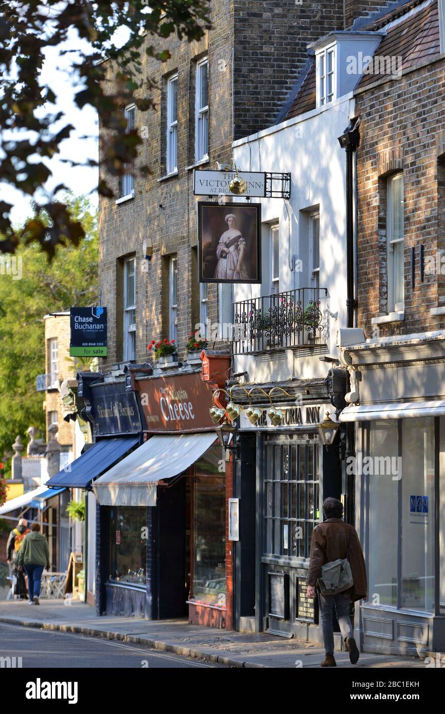 Richmond Hill, Richmond, London, UK, showing shops and The Victoria Inn. Stock Photo