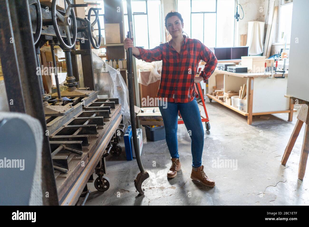 Portrait of confident craftswoman in her workshop Stock Photo