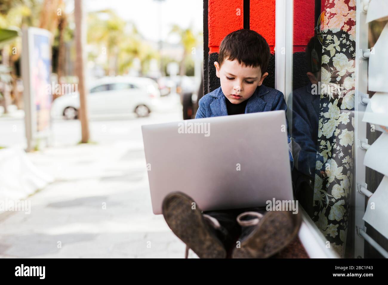 Portrait of little boy using laptop Stock Photo - Alamy