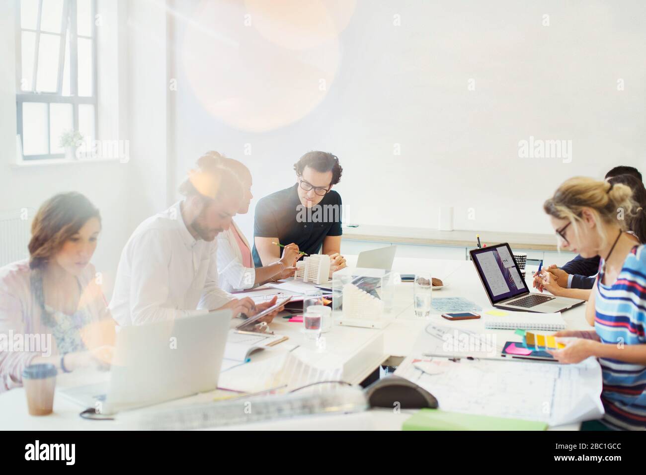 Designers working in conference room meeting Stock Photo