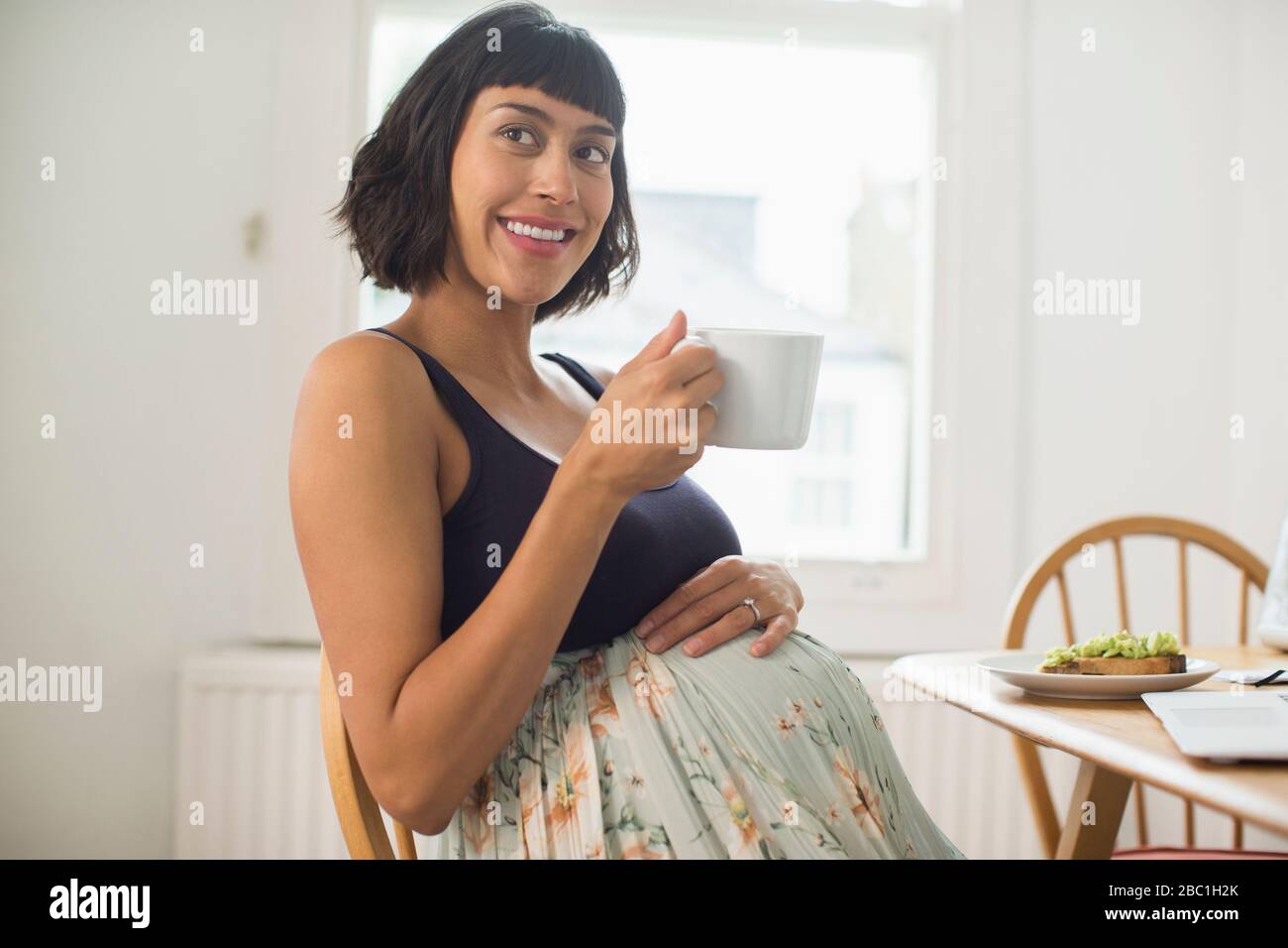 Portrait happy pregnant woman drinking tea Stock Photo Alamy