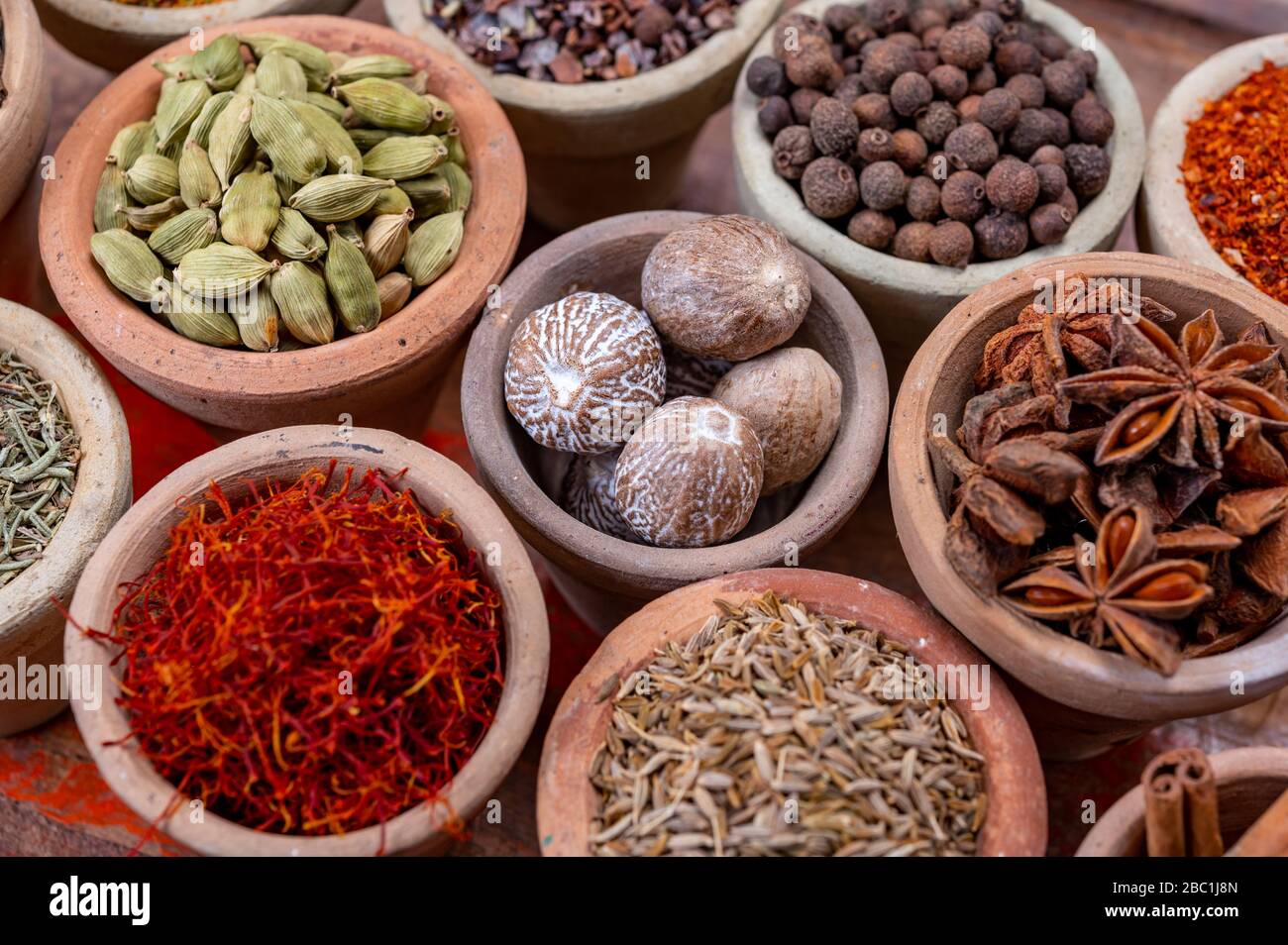 Indian spices collection, dried colorful condiment, nuts, pods and ...