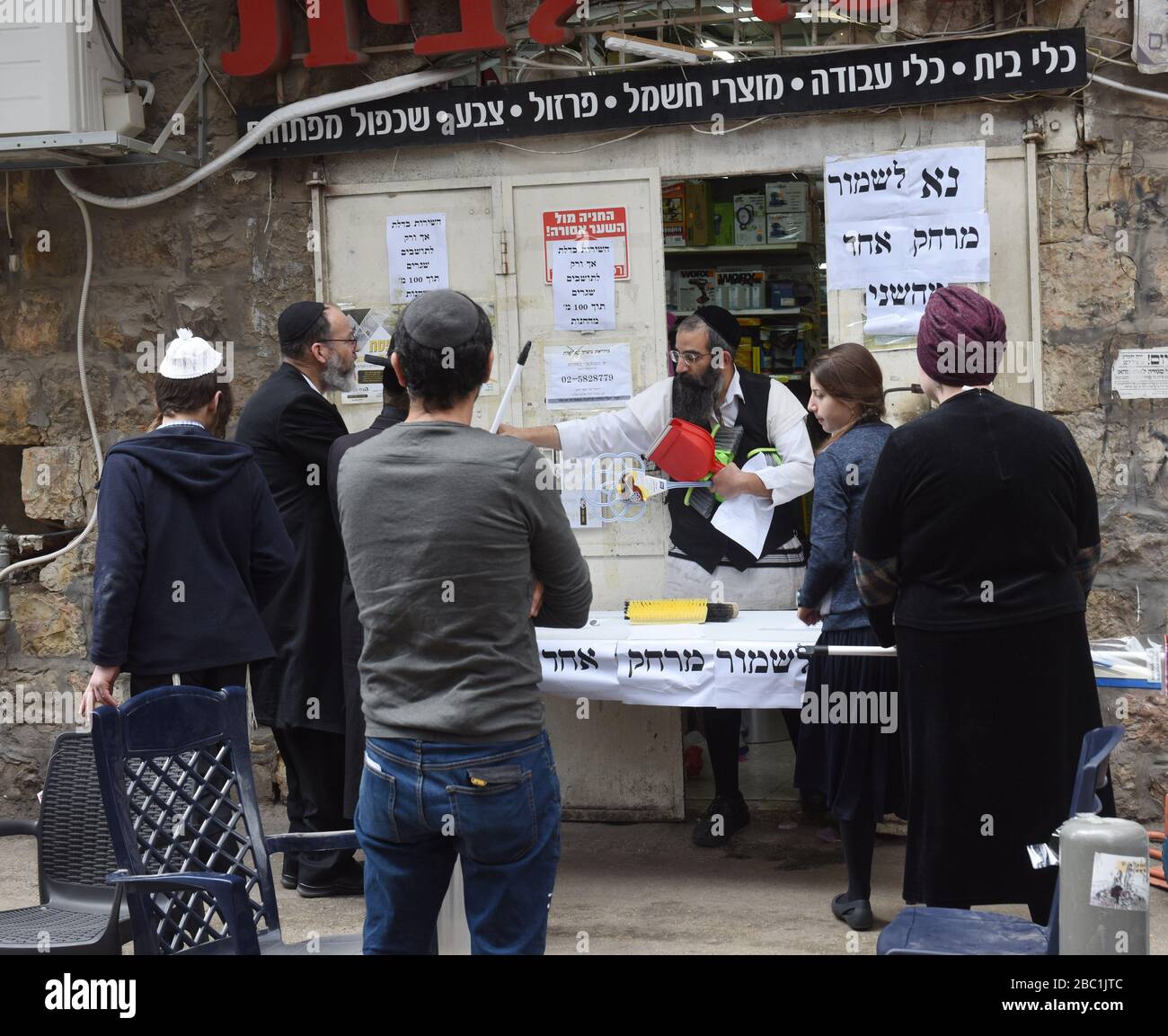 Jerusalem, Israel. 02nd Apr, 2020. An Ultra-Orthodox Jew sells cleaning supplies from a half-closed shop, because of coronavirus restrictions, in the Mea Shearim neighborhood in Jerusalem, on Thursday, April. 2, 2020. The cases of coronavirus has jumped in Israeli Ultra-Orthodox cities, amid growing concerns of a major outbreak of COVID-19 in the religious communities. Photo by Debbie Hill/UPI Credit: UPI/Alamy Live News Stock Photo