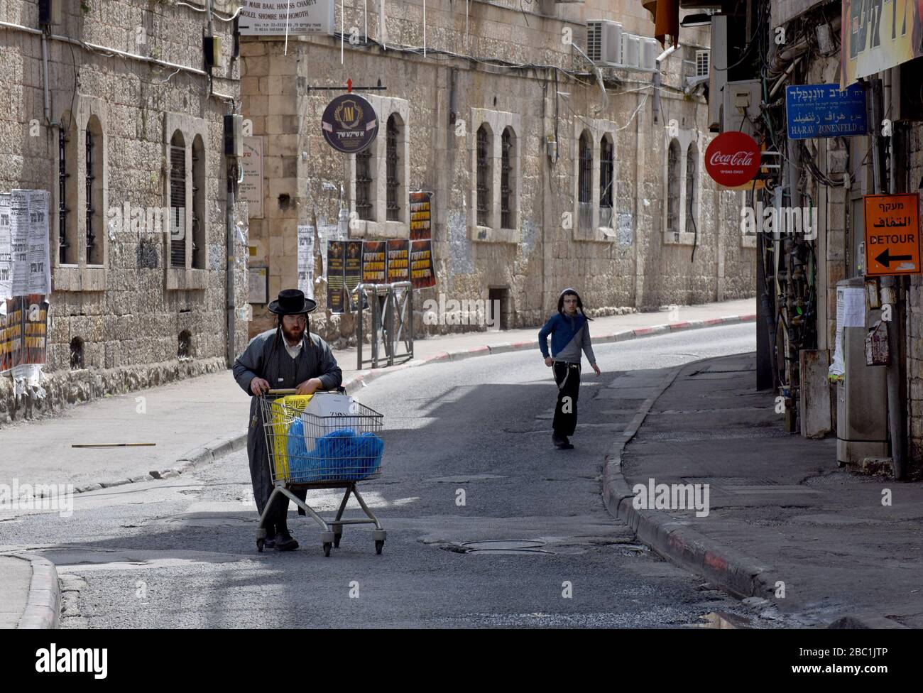 Jerusalem, Israel. 02nd Apr, 2020. An Ultra-Orthodox Jew pushes a grocery cart in the Mea Shearim neighborhood in Jerusalem, on Thursday, April. 2, 2020. The cases of coronavirus has jumped in Israeli Ultra-Orthodox cities, amid growing concerns of a major outbreak of COVID-19 in the religious communities. Photo by Debbie Hill/UPI Credit: UPI/Alamy Live News Stock Photo